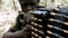 A Ugandan soldier tracking down Lord's Resistance Army (LRA) fugitive leaders takes position behind a machine gun at a forest bordering Central African Republic (CAR), South Sudan and Democratic Republic of Congo, near river Chinko, (File photo).