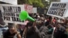 Kenyans demonstrate against their Members of Parliament who last week quietly awarded themselves a $110,000 bonus for five years of service in parliament, in downtown Nairobi, Kenya, October 9, 2012.