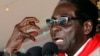 Zimbabwe's President Robert Mugabe gestures as he speaks during an event marking his 89th birthday in Bindura, about 90 km north of the capital Harare Mar. 2, 2013. 