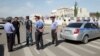 Investigators, Interior Ministry officers and members of security forces gather near the site of a bomb blast outside China's embassy in Bishkek, Kyrgyzstan, August 30, 2016.