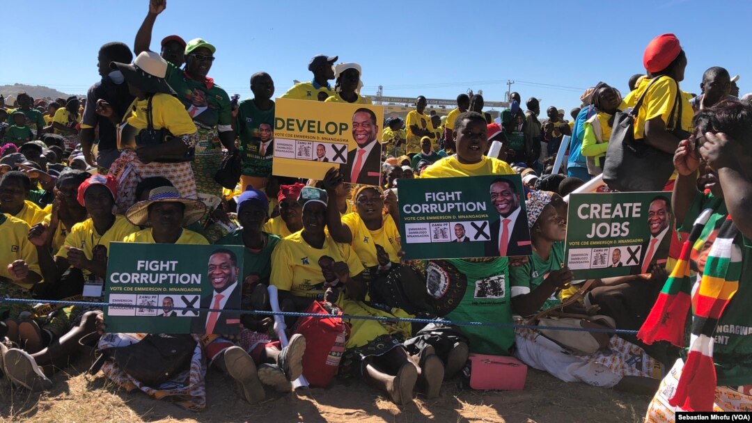 Members of Zanu PF rally in Mutoko, about 200km east of Harare displaying to President Emmerson Mnangagwa on June 9, 2018 what they want him address if he wins the July 30 Zimbabwe general election.