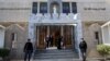Iraqi police officers guard the entrance of St. Joseph's Chaldean Church before a Christmas mass in Baghdad, Iraq, Dec. 25, 2013.