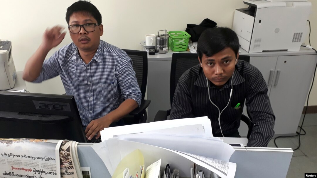 Reuters journalists Wa Lone, left, and Kyaw Soe Oo, who are based in Myanmar, pose for a picture at the Reuters office in Yangon, Myanmar, Dec. 11, 2017. 