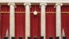 FILE - This Sept. 19, 2020, photo provided by the Supreme Court, shows the Bench draped in memory of liberal Justice Ruth Bader Ginsburg, at the Supreme Court in Washington. Republicans are rushing to fill the vacant seat with their conservative nominee.
