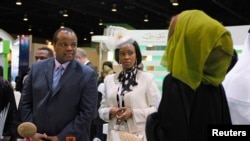 Mswati III, King of Swaziland (L) tours the exhibition hall during the first day of the World Energy Forum at the Dubai World Trade Centre, Oct. 22, 2012. 