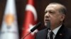 Turkey's president and leader of ruling Justice and Development Party, Recep Tayyip Erdogan, addresses supporters and lawmakers at the parliament in Ankara, Turkey, Jan. 9, 2018. 