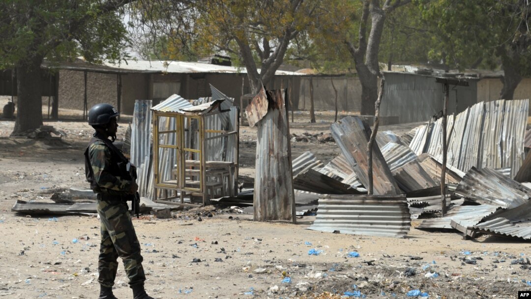 FILE - A picture taken on February 17, 2015 shows a Cameroonian soldier walking in the Cameroonian town of Fotokol, on the border with Nigeria, after clashes occurred on Feb. 4 between Cameroonian troops and Nigeria-based Boko Haram insurgents. 