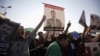 Members of the Muslim Brotherhood and supporters of deposed Egyptian President Mohamed Morsi shout slogans during a protest at Rabaa Adawiya Square, where they are camping, in Nasr City, east of Cairo, Aug. 7, 2013.