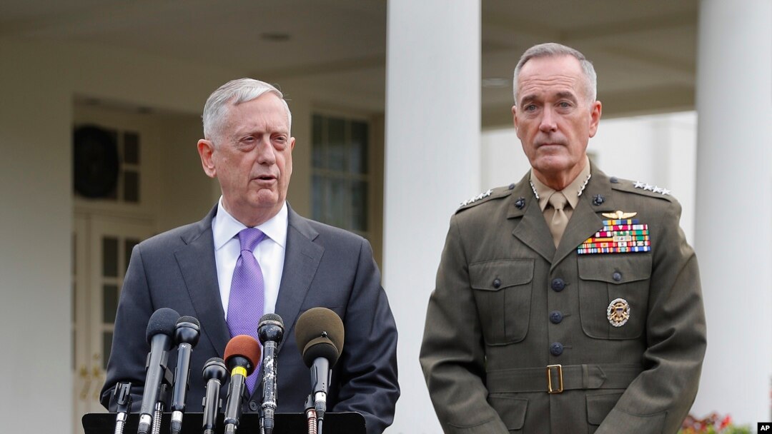 Defense Secretary Jim Mattis, left, accompanied by Joint Chiefs Chairman Gen. Joseph Dunford, right, speaks to members of the media outside the West Wing of the White House in Washington, Sunday, Sept. 3, 2017, regarding the escalating crisis in North Korea's nuclear threats.