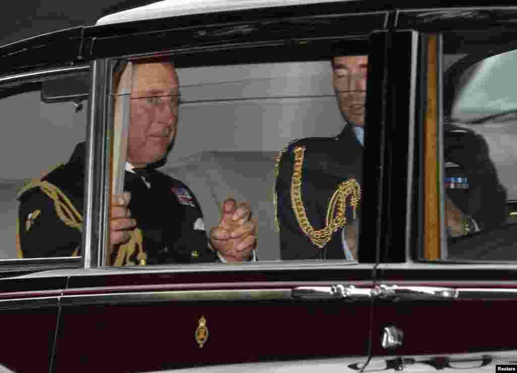 Britain's Prince Charles arrives for the christening of Prince George at St. James's Palace in London, Oct. 23, 2013.