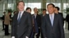 Britain's Chancellor of the Exchequer George Osborne (l) and Industrial and Commercial Bank of China Ltd (ICBC) Chairman Jiang Jianqing during his visit to the ICBC headquarters in Beijing, Oct. 15, 2013. 