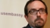 John Bass, shown while serving as U.S. ambassador to Georgia on June 28, 2012, attends a news conference in Tbilisi. Bass — the current ambassador to Turkey — is upset by Ankara's arrest of U.S. employee Metin Topuz.