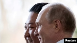 FILE PHOTO: FILE PHOTO: Russian President Vladimir Putin and North Korea's leader Kim Jong Un meet in Vladivostok in 2019