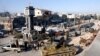 Soldiers loyal to the Syrian regime with their military tanks in Qusair, after the Syrian army took control of the city from rebel fighters, June 5, 2013. 