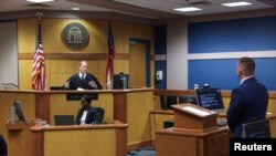 Georgia charges Trump with racketeering in election subversion case