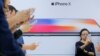 Attendees use new iPhone X during a presentation for the media in Beijing, China, Oct. 31, 2017. 