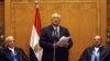 Adli Mansour (C), Egypt's chief justice and head of the Supreme Constitutional Court, speaks at his swearing in ceremony as the nation's interim president in Cairo, July 4, 2013, a day after the army ousted Mohamed Morsi as head of state.