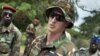 U.S. Army special forces Captain Gregory, 29, from Texas, center, who would only give his first name in accordance with special forces security guidelines, speaks with troops from the Central African Republic and Uganda, in Obo, Central African Republic, 