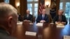 FILE - U.S. President Donald Trump, second from right, speaks in the Cabinet Room of the White House in Washington, April 9, 2018, at the start of a meeting with military and national security leaders. 