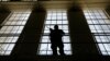 A guard stands watch over the east block of death row at San Quentin State Prison, Aug. 16, 2016, in San Quentin, Calif. 