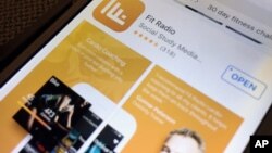 The Fit Radio application icon is displayed on an iPhone, Jan. 23, 2018, in New York. 