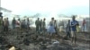 People assess the damage in part of a burned down market in Limbe, Cameroon, April 3, 2017. (M.E. Kindzeka/VOA)