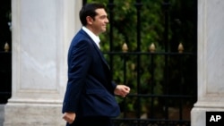 The leader of Greece's Syriza party Alexis Tsipras arrives at the Presidential Palace in Athens, Sept. 21, 2015.