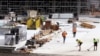 Workers go about their duties at a construction site in Sydney, Wednesday, Sept. 2, 2020. 