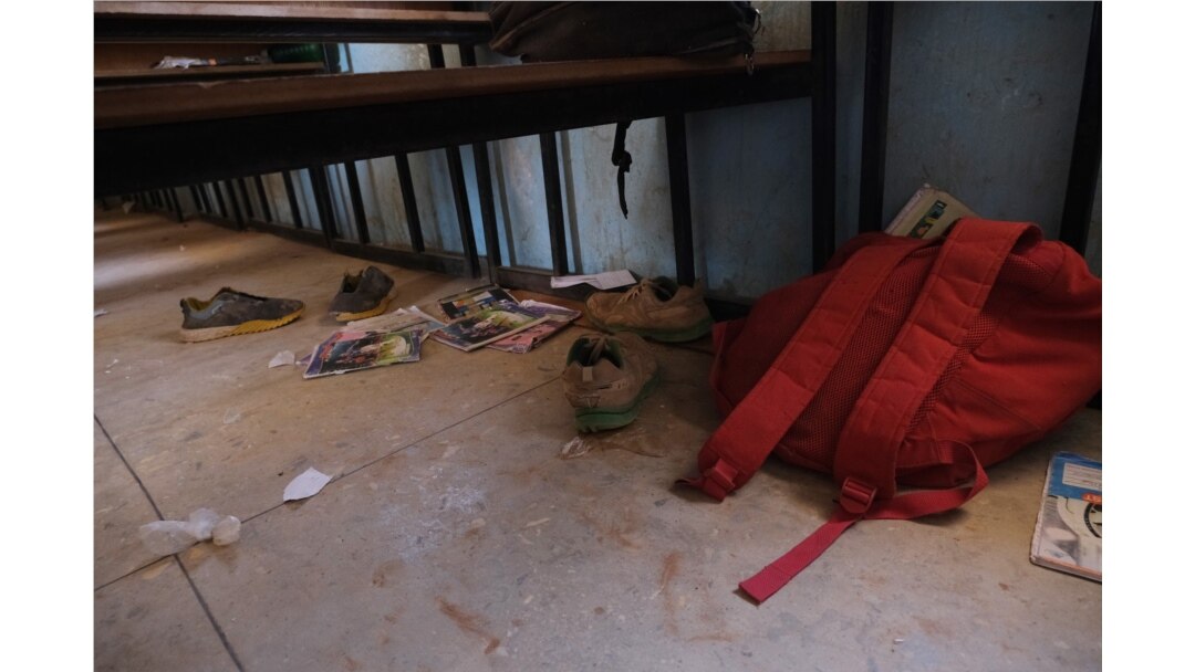 FILE - School bags and supplies belonging to pupils at the Government Science School are seen on the floor where gunmen abducted students, in Kankara, in northwestern Katsina state, Nigeria, Dec. 15, 2020.