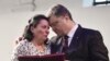 Ukrainian President Petro Poroshenko, right, presents a Hero of Ukraine award to a relative of an activist killed a year ago during mass protests, at the award ceremony in Kyiv, Feb. 20, 2015.