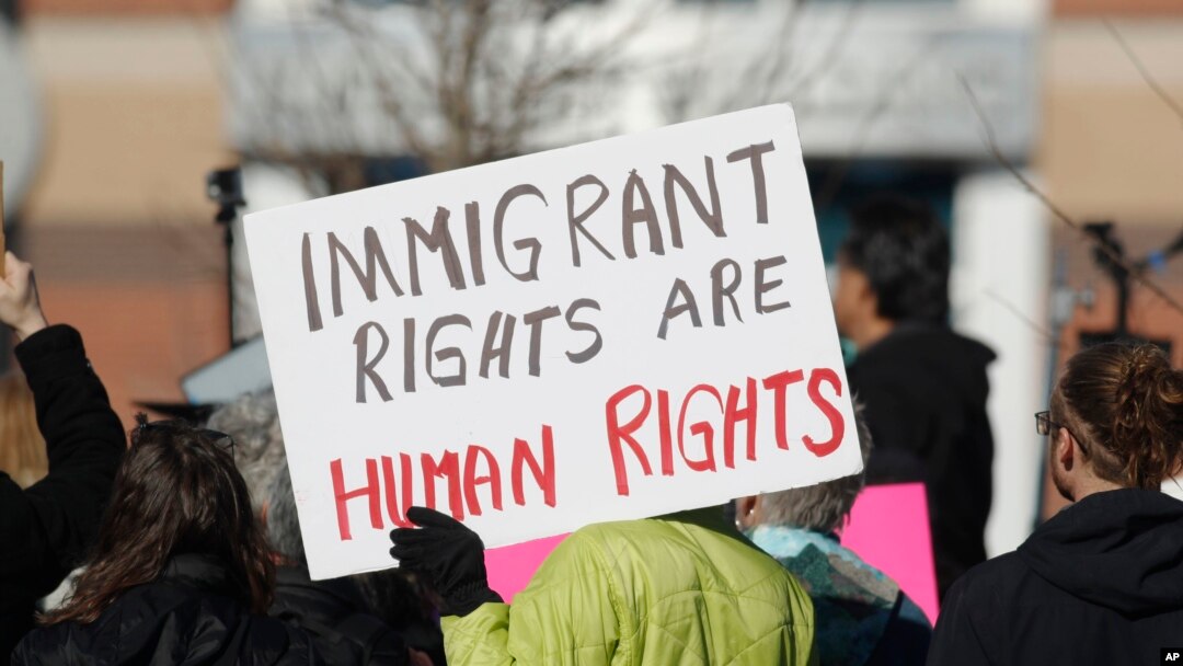 A supporter holds up a placard during a rally for Jeanette Vizguerra, a Mexican woman seeking to avoid deportation from the United States, outside the Immigration and Customs Enforcement office in Centennial, Colo., Feb. 15, 2017. U.S. immigration authorities have denied Vizguerra's request to remain in the country.