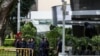 Police officers patrol the perimeter of the St. Regis Hotel in Singapore, June 11, 2018, ahead of the summit between U.S. President Donald Trump and North Korean leader Kim Jong Un. 
