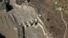 An aerial view shows a damaged barrage after a flash flood swept a mountain valley destroying dams and bridges, in Tapovan in the northern state of Uttarakhand, India, Feb. 12, 2021. 