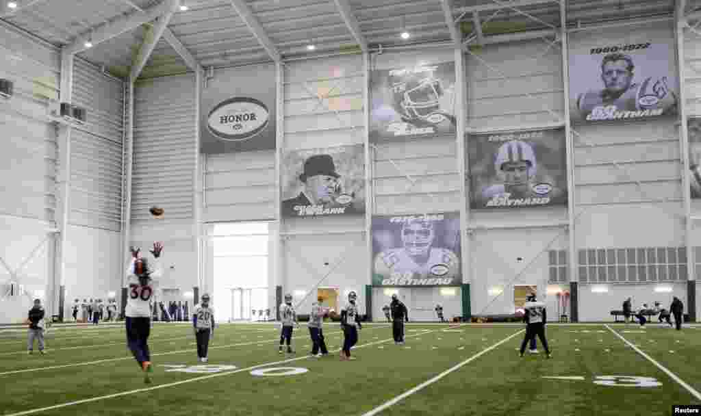 Denver Broncos strong safety David Bruton runs an interception drill during an indoor practice session for the Super Bowl at the New York Jets Training Center in Florham Park, New Jersey, Jan. 30, 2014.