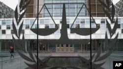 FILE - A person leaves the International Criminal Court in The Hague, Netherlands, Jan. 16, 2019.