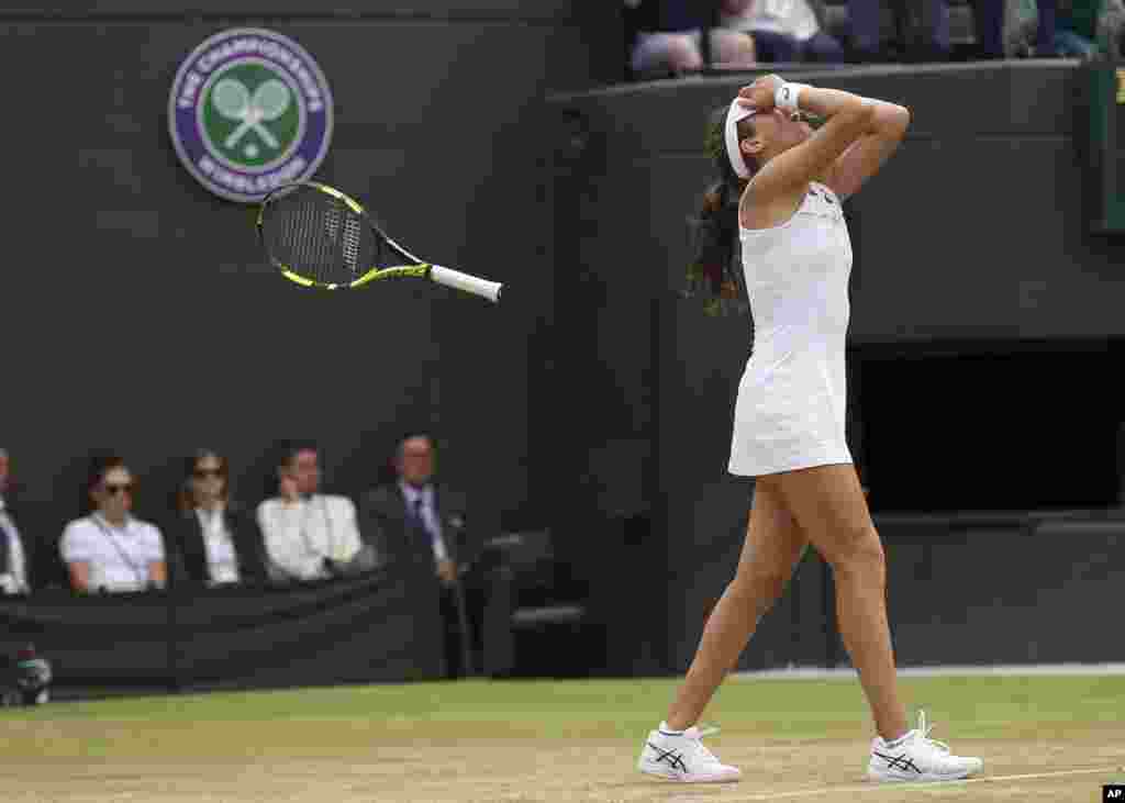 Britain's Johanna Konta celebrates after beating Caroline Garcia of France in their Women's Singles match on day seven at the Wimbledon Tennis Championships in London.