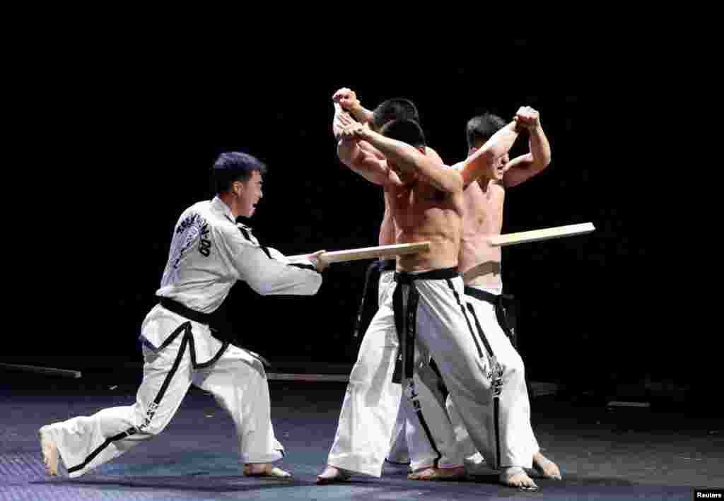 Members of North Korea-led International Taekwondo Federation (ITF) demonstrate their skills at the World Taekwondo Headquarters 'Kukkiwon' in Seoul, South Korea, June 28, 2017.