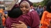 Brooklyn College humanities and social sciences graduate Ameera Badamasi, center, from Nigeria, hugs a student after the college's commencement ceremony, where Sen. Bernie Sanders, I-Vt., delivered the keynote address, May 30, 2017.