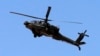 An Egyptian military helicopter is seen deployed in the northeastern part of the Sinai Peninsula near the Rafah border crossing between Egypt and the Gaza Strip in this May 21, 2013, file photo.