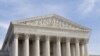 Lawyer walks down steps of US Supreme Court in Washington D.C. (2011 file photo)