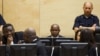 FILE - Congolese ex-militia boss Mathieu Ngudjolo (C) waits for the verdict on his trial at the International Criminal Court in The Hague, December 18, 2012.