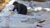 Children are among bodies of people activists say were killed by nerve gas in the Ghouta region, in the Duma neighborhood of Damascus Aug. 21, 2013. 