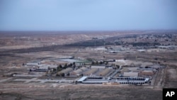 FILE - Al-Asad air base is seen in the western Anbar desert, Iraq, Dec. 29, 2019.