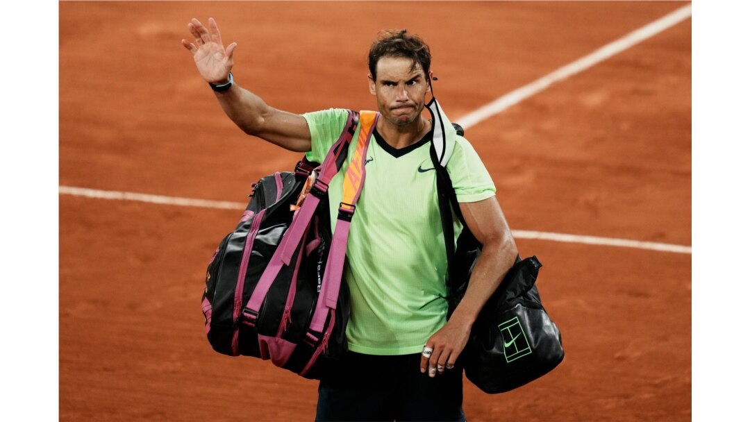 FILE - Spain's Rafael Nadal waves to the crowd after losing to Serbia's Novak Djokovic in their semifinal match of the French Open tennis tournament at the Roland Garros stadium in Paris, June 11, 2021.