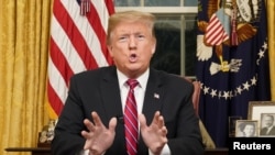 President Donald Trump delivers a televised address to the nation from his desk in the Oval Office about immigration and the southern U.S. border on the 18th day of a partial government shutdown at the White House in Washington, Jan. 8, 2019.