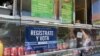 A voter registration sign is seen on a taco truck, as part of the U.S. Hispanic Chamber of Commerce's "Guac the Vote" campaign, in Houston, Texas, Sept. 29, 2016. 