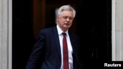 FILE - Britain's Secretary of State for Exiting the European Union David Davis leaves Downing Street, London, July 11, 2017. 