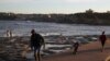 Families enjoy a clear evening on the coast in Sydney, Australia, on May 6, 2020.