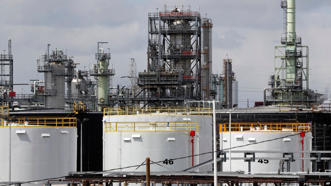 FILE - Storage tanks are shown at a refinery in Detroit, April 21, 2020.