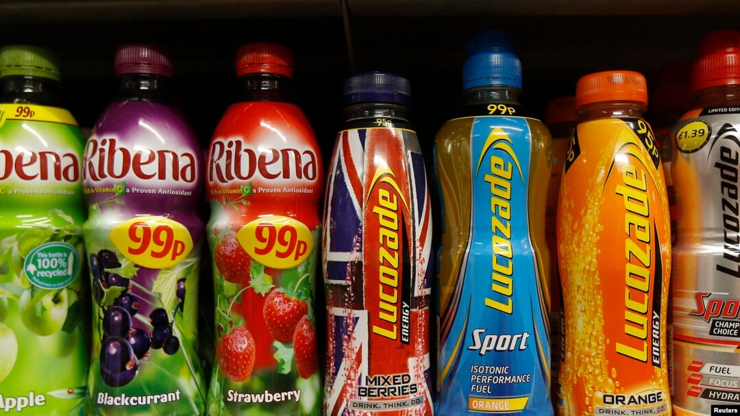 FILE - Soft drinks in bottles are displayed on a shelf in a shop in London, April 24, 2013. 